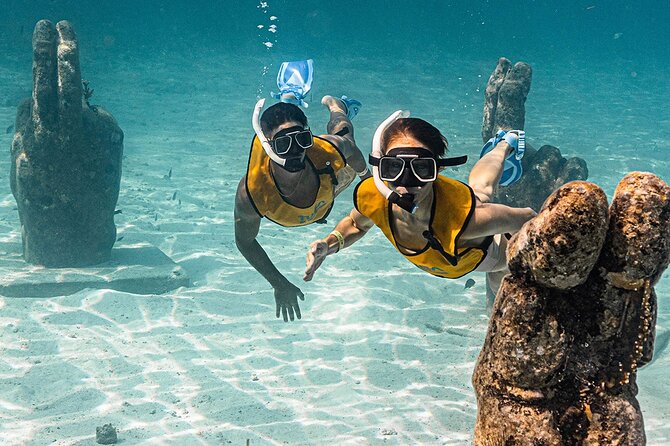 All-Inclusive Isla Mujeres Catamaran with Free Transportation - Isla Mujeres lunch and beach club time: Zaza or Ice Bar, plus the sandbar swim