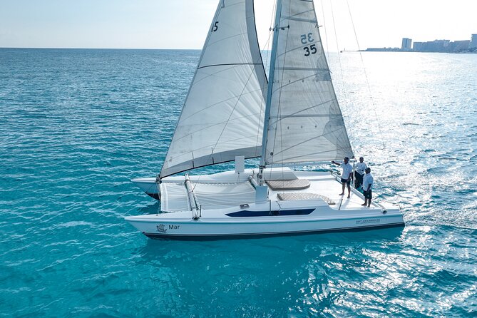 All-Inclusive Isla Mujeres Catamaran with Free Transportation - Oceanix Nauticos catamaran ride: open bar, safety briefing, and comfort