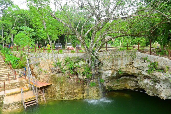 Cancun ATV Tour with Zipline, Cenote & Transportation - Cenote swim and jump platform in natural freshwater