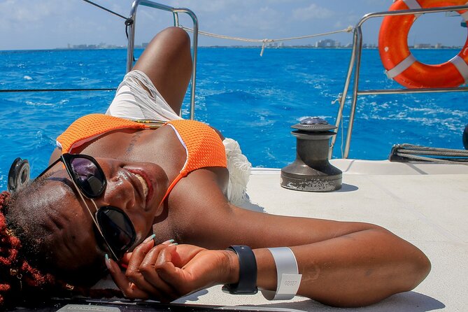 Cancun Catamaran: Sail to Isla Mujeres + Buffet & Drinks - Isla Mujeres time: Playa Norte and beach-club lunch with an international buffet