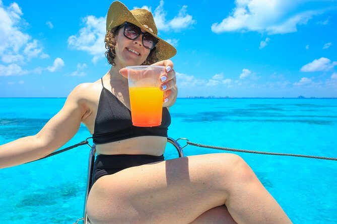 Cancun Catamaran: Sail to Isla Mujeres + Buffet & Drinks - Food, drinks, and crew vibe on a shared catamaran