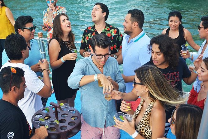 Cancun Dancer Cruise to Isla Mujeres with Snorkeling and Lunch - Onboard fun: water slide, salsa lesson, and party-boat energy