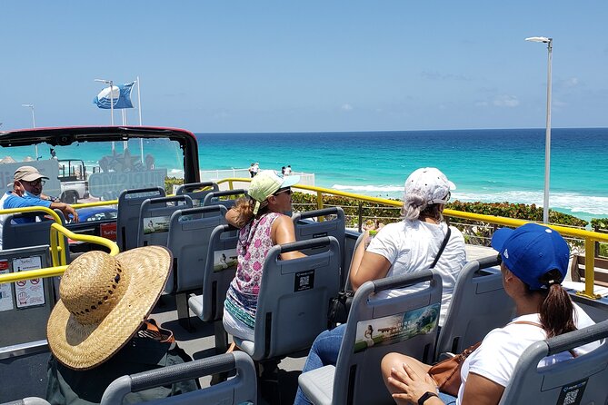 Cancun Guided Bus City Tour (from Cancun and Riviera Maya) - Playa Delfines and the Cancun sign: photo time in real heat