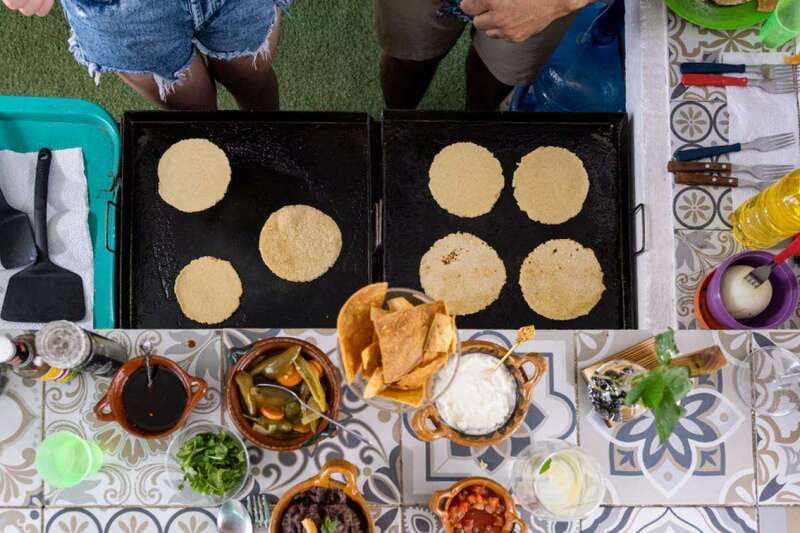 Cancun: Handmade Traditional Mexican Tortilla Making Class - Welcome shot, agua fresca, and getting set up for masa harina