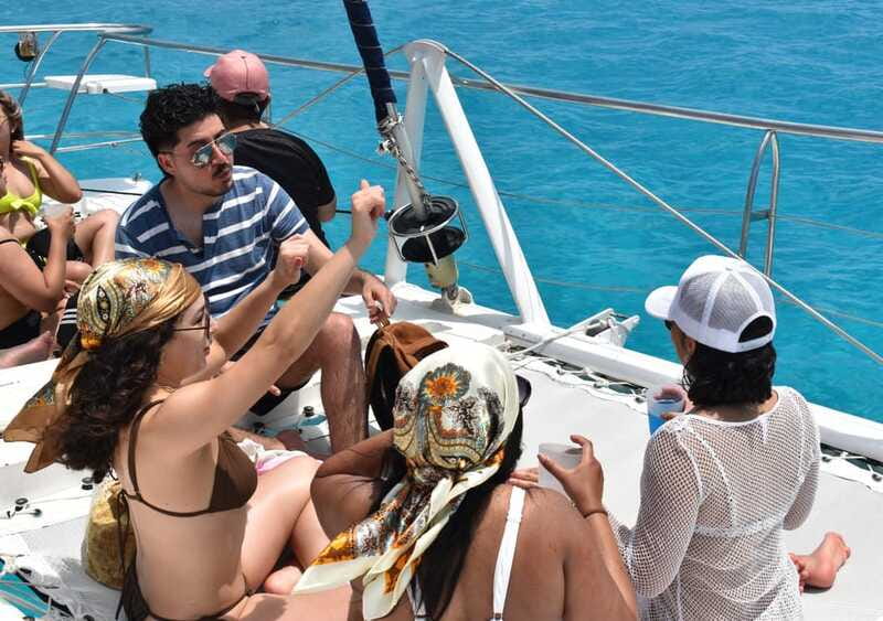 Cancun: Isla Mujeres Only Adults Catamaran, drinks & snorkel - Leaving Cancun on an Only Adults catamaran with DJ energy