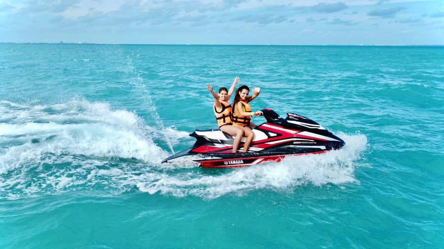 Cancun: Jet Ski Rental in Ocean Side - Getting to the Activity Spot by Hyatt Ziva and the Delphinus Sign