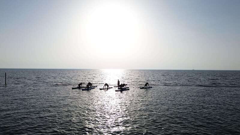 Cancún: Sup Yoga and Meditation over the Caribbean Sea - Puerto Cancún private beach access and how to find the meeting point