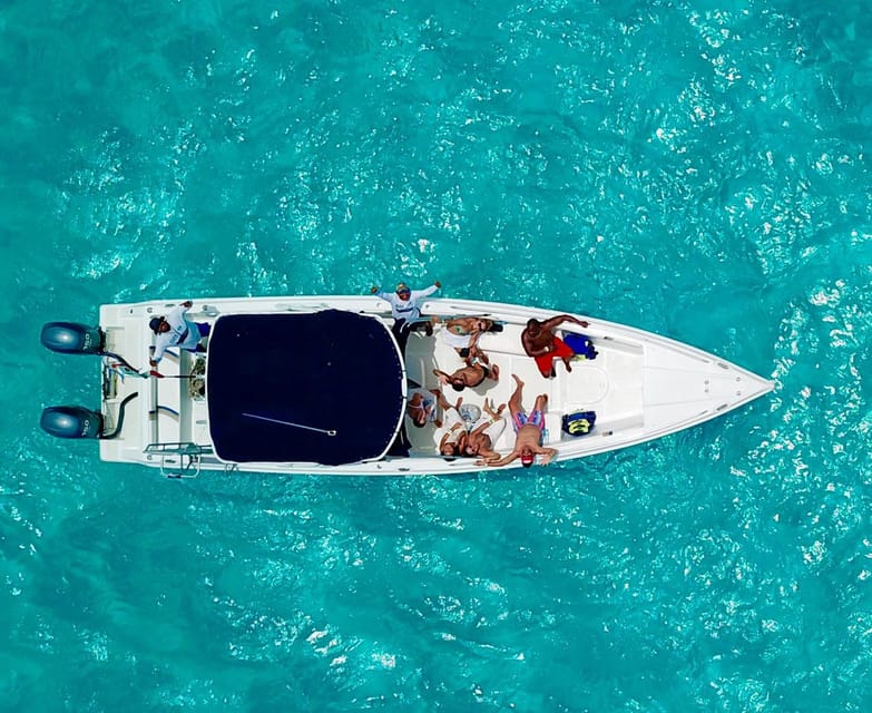Cancún: Swim with Whale Sharks & Playa Norte Beach - Cancun marina start, coffee in hand, and a real safety briefing