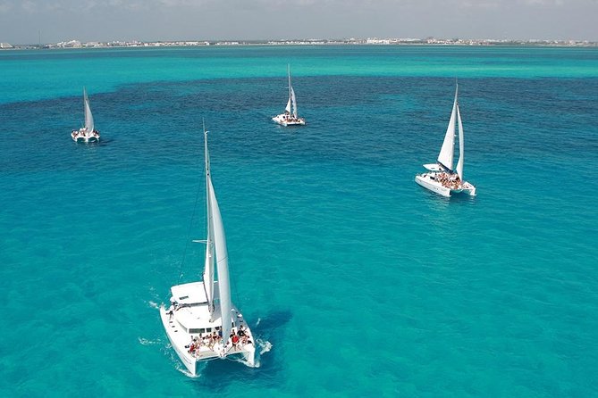 Catamaran adventure to Isla Mujeres with Snorkel,Buffet,Open Bar and Beach Club - Snorkeling on Isla Mujeres reefs: fun, but plan for group limits