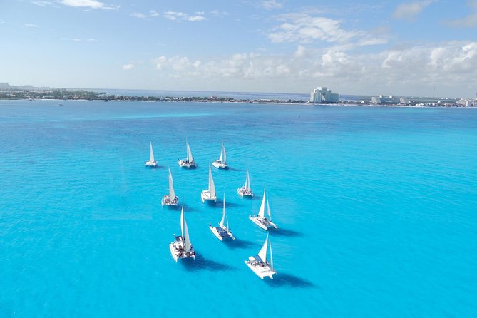 Catamaran Isla Mujeres Tour with Hotel Pick Up included - Hotel pickup and the Marina Aquatours meeting point
