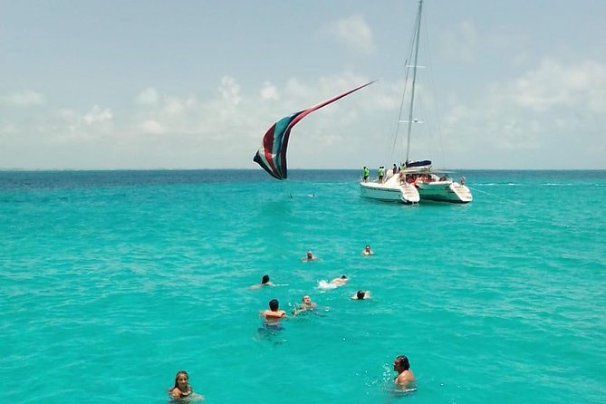 Catamaran to Isla Mujeres, Open bar, buffet, Beach Club Included - Out on the water from Cancun: music, staff activities, and the spinnaker if the weather cooperates