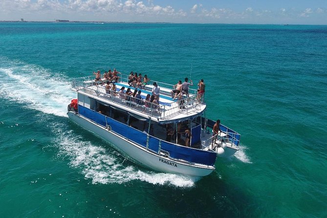 Catamaran Tour to Isla Mujeres all Included - Drinks, music level, and sun safety during snorkeling