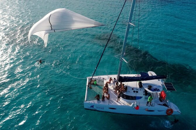 Catamaran Tour to Isla Mujeres, Open bar, Lunch, Snorkeling, Beach Club Included - Snorkeling at El Meco Reef: Great Water, Short Time