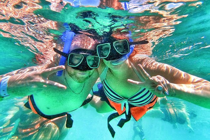 Catamaran with Snorkeling and North Beach, Isla Mujeres - Start at Playa Tortugas: smooth pickup, quick registration, and your first swim-proof steps