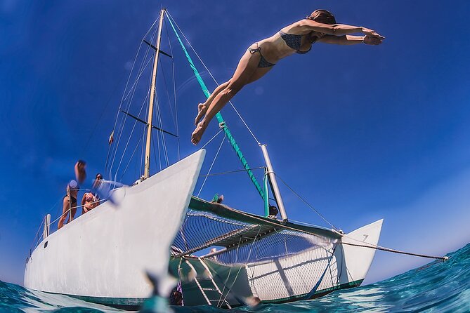 Discover Isla Mujeres: Catamaran, Snorkeling, and "Ice Bar" - A catamaran day built around four different moods
