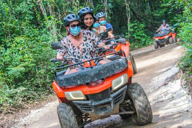 Drive an Atv shared, swim in a Cenote and ziplines in the Cancun - Cenote swim: cool water, quick time, and possible jumps