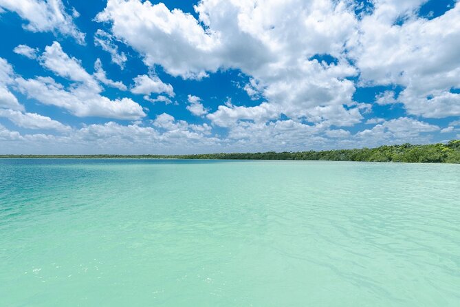 Eco Adventure At 3 Cenotes & 1 Lagoon ! From Cancun & Riviera - Stop 1: Laguna Kaan Luum, shallow warm water and a deep cenote in the middle