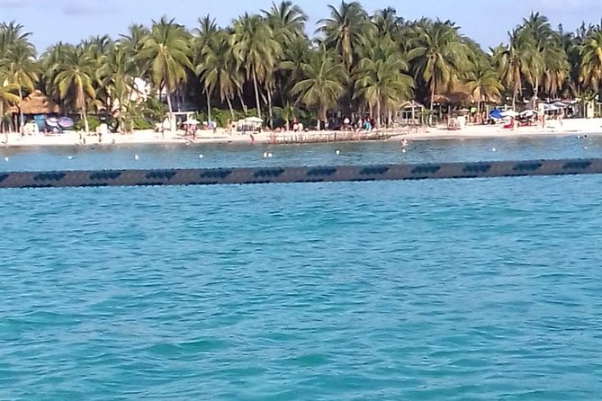 Enjoy an amazing day in Isla Mujeres with snorkeling food, drinks and round trip - The catamaran cruise: views, music, and that first sip of vacation