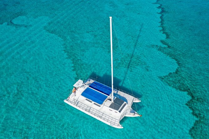 HipHop Catamaran Party from Cancun to Isla Mujeres - Beach club lunch and open bar: DJ beats, buffet comfort, and frozen drinks