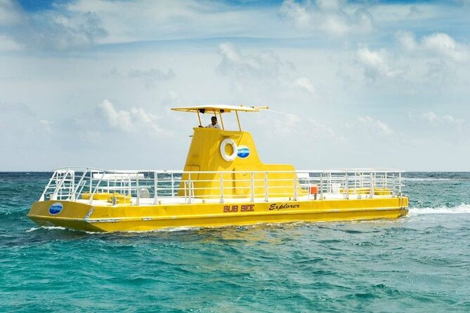 Hop-on Hop-off City Tour Cancun plus Submarine or Bodyboard Experience - Aquaworld, Dolphins Beach, and the Cancun sign photo moment