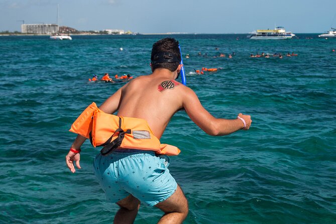 Isla Mujeres Catamaran from Cancun with Open bar and lunch - Isla Mujeres Free Time: Shop, Wander, and Choose Your Own Pace
