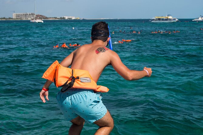 Isla Mujeres Catamaran Tour with Open Bar, Lunch and Snorkeling - Group size, boat feel, and why some days feel chaotic