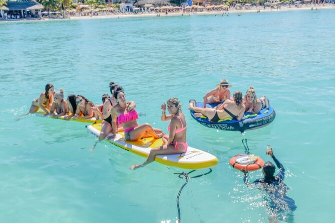 Isla Mujeres Catamaran Tour with Snorkel, Open bar and Transport - Open bar, music on deck, and the buffet meal reality check