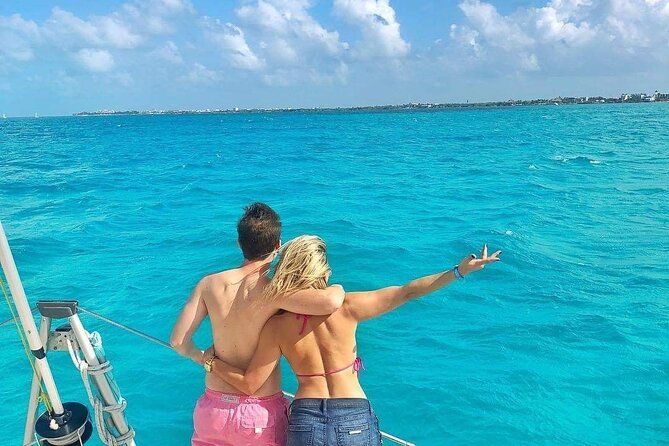 Isla Mujeres Catamaran Tour with Snorkel, Open bar and Transport - Value math for $85, plus the upgrade and pickup details that change totals