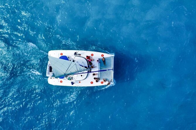 Isla Mujeres: Catamaran Tour with Snorkeling Food, Drinks, Beach - Isla Mujeres Center Stop: Shops, Tequila, and Beach-Edge Views