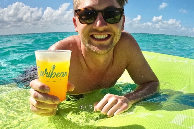 Isla Mujeres Catamaran Tour with Snorkeling, Open Bar & Buffet - Snorkeling on Isla Mujeres: Reef Time and Weather Reality