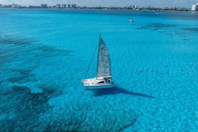 Isla Mujeres Day Tour with Catamaran, Snorkeling & Beach Club - Bahia Mujeres reef snorkeling: short, physical, and very weather-tied
