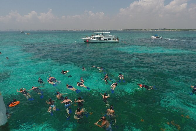 Isla Mujeres Full Day Tour on Yacht with Snorkel and Buffet - The Return Trip Party, Music, Games, and a Sweet Surprise