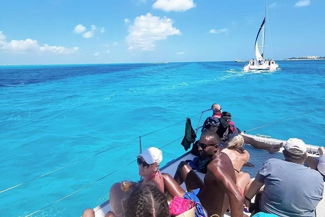 Isla Mujeres Premium Catamaran Tour with transportation from Playa del Carmen - Price and logistics: what $89 buys, plus the $25 port add-on