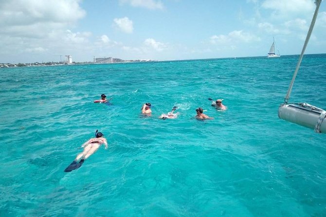 Isla Mujeres Premium Catamaran Tour with transportation from Playa del Carmen - Premium catamaran comfort, open bar, and crew energy