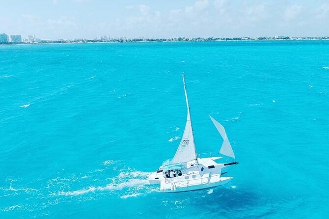 Isla Mujeres Premium Tour in Private Catamaran with Lunch - Checking in at Playa Tortugas, lockers, and the extra $25 reality