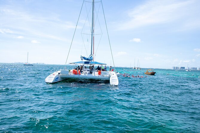 Isla Mujeres Tour on Catamaran with Snorkel, Open Bar, Buffet & Beach club - Snorkeling El Meco Reef (about 35 minutes): rules that affect your day
