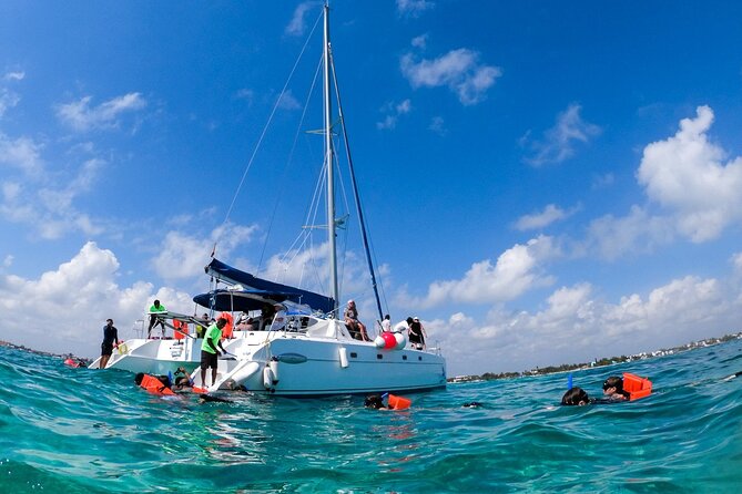 Isla Mujeres Tour on Catamaran with Snorkel, Open Bar, Buffet & Beach club - Beach club time: buffet lunch, views, and open bar break