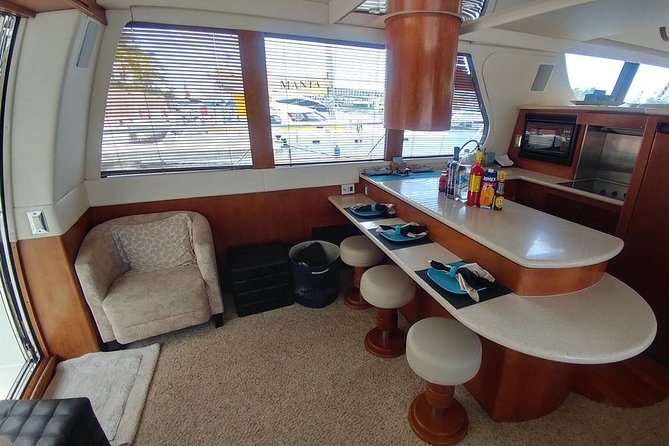 Playa Mujeres rent a Yacht 4hrs with Food and drinks aboard CA55 - Price and value: how to judge the $2,400 group cost