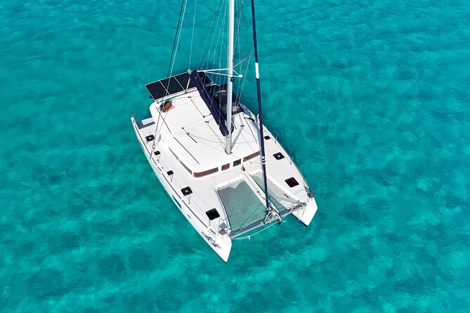 Private Catamaran Tour Super to Isla Mujeres - Crew energy on board: captain, guides, and that music-and-mood factor