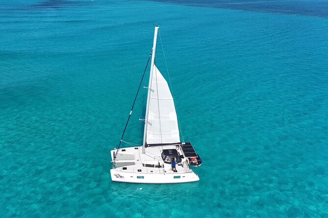 Private Catamaran Tour Super to Isla Mujeres - The 7-hour flow: morning pickup, reef time, Beach Club lunch, island wandering