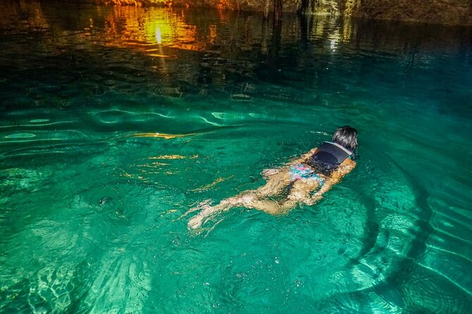 Shared ATV's and Zip Lines and Swimming in a Real Cenote. - Swimming in a cenote cavern: cool water, life vest, about an hour