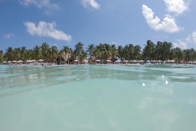 The Best Catamaran tour to Isla Mujeres with Open Bar and Lunch - Isla Mujeres arrival: beach club lunch, showers, and real downtime