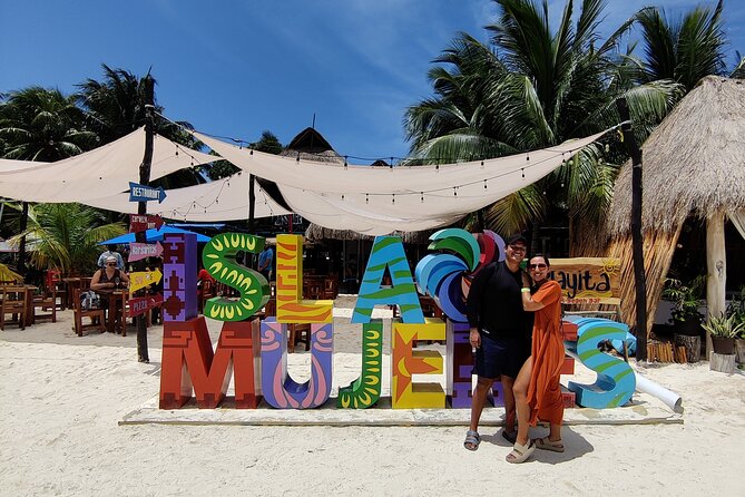 Top Isla Mujeres Catamaran Tour with Snorkel Open Bar and Buffet lunch - Extra fees, docking tax, and avoiding sticker shock