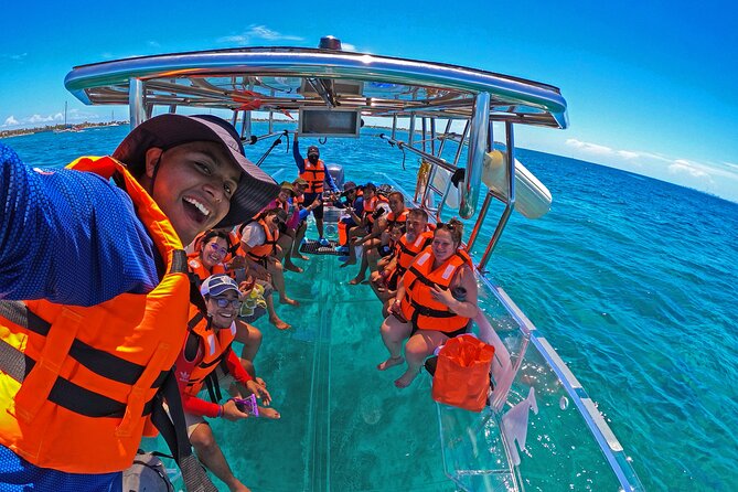Tour Isla Mujeres excursion in Collective Transparent Boat - What You’ll See: Fish, Turtles, Stingrays, Coral, and More