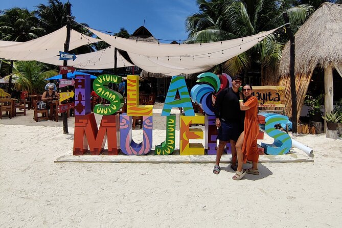 Trip to Isla Mujeres by Catamaran, with snorkeling and drinks - Onboard crew, safety focus, and the entertainment factor